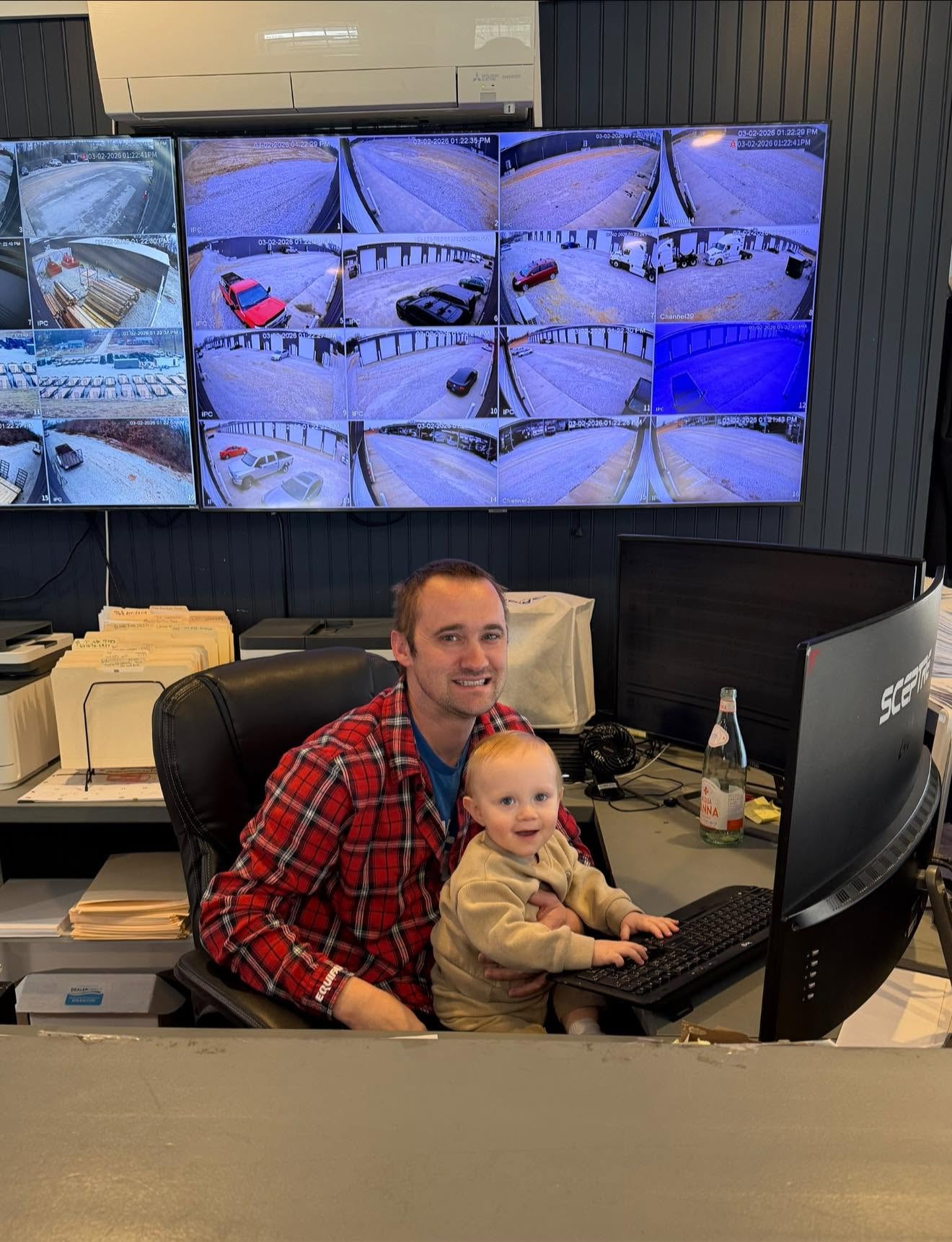 Mitchell at the Newline Trailer office with his oldest son